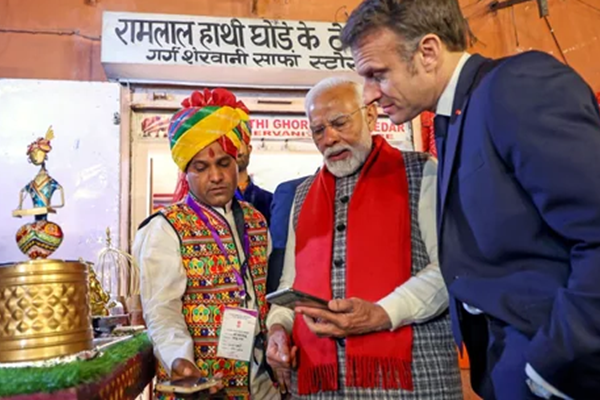 President Macron paying masala chai with UPI.